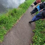 team members walking along tow path of canal